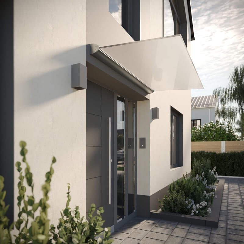 Freitragende Überdachung aus Glas mit Weißglas und Satinierung an grauer Hausfassade