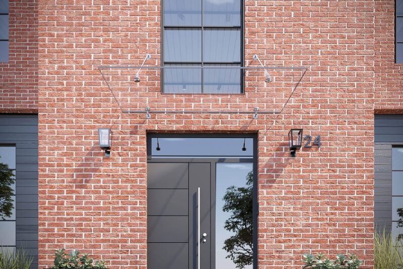 Punktgehaltenes Glasvordach mit Zugstangen