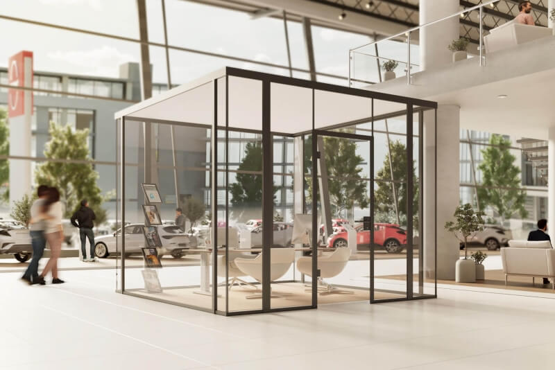 Raum-in-Raum-System in quadratischer Form in einem Autohaus